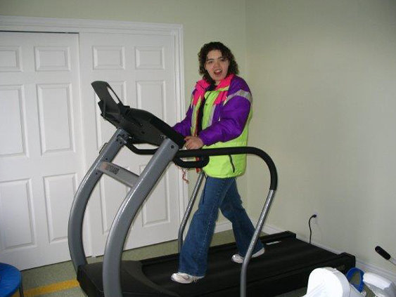 Smiling woman on treadmill